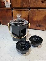 Ice bucket with lid and two candlesticks, full view