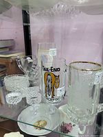 Group shot showing branded beer glasses, tankard, cut-glass ashtrays and napkin holders