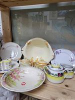 Group shot of all porcelain pieces on shelf