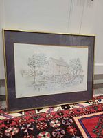 Full view of framed drawing showing frame, mat and artwork