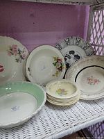Group shot of platters and bowls on shelf