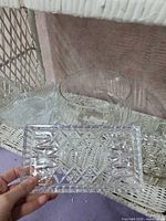 Footed round bowl, small round bowl, and edge of rectangular dish