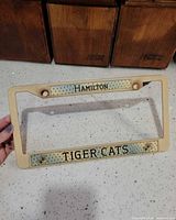Full view of Hamilton Tiger-Cats license plate frame showing overall design