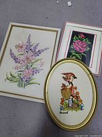 Group shot of three framed textile pieces