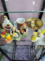 Group shot of entire lot on glass shelf