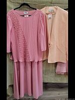 Blouse and blazer hanging to show front view and color contrast