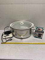 Group shot of slow cooker, decanter warmer, boxed Microperk coffee maker