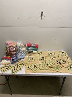 Table view showing alphabet panels and bagged yarn items