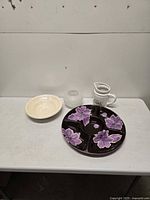 Overall view of all four pieces on table: platter, DecorCraft bowl, frosted bowl, pitcher