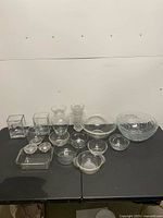 Group shot of all clear glass items on table