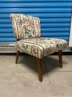 Full view of floral upholstered slipper chair