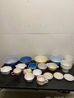 Group shot of all bowls, mugs, dishes on table