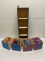 Overall view of cabinet and four drawers with pens