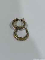Both individual hoop earrings side by side