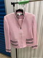 Front of pink St. John jacket on hanger