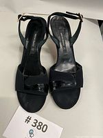 Top view of both shoes showing suede and patent leather uppers, open toes, slingback straps, size tag visible