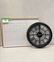 Calendar whiteboard and clock side by side