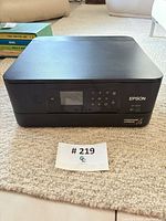 Front view of Epson XP-6100 printer showing control panel and display