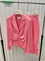 Blazer and skirt on hangers front view