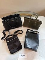 All four handbags laid out on table