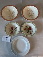 Overview of five pieces: two Royal Doulton serving bowls, two Royal Albert soup bowls, one Tafelstern plate