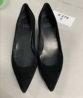 Top view of both black suede Stuart Weitzman pumps