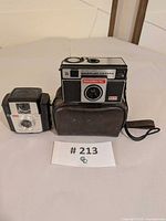 Front view of both cameras and case