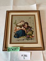 Full view of framed needlepoint with measurement note