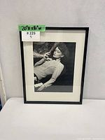 Front view of framed print showing subject and dimensions tag