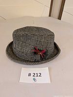 Front view of Pendleton houndstooth wool fedora with feather accent