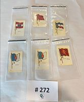 Six silk flag cards in plastic sleeves