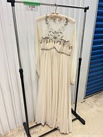 Front view of full gown on hanger