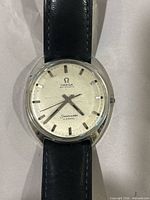 Front close-up showing dial, branding, indices, hands, case condition