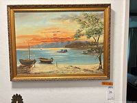 Front view of framed oil painting on wall