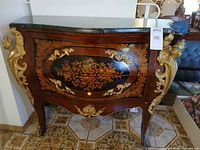 front view showing marquetry, gilt mounts, marble top