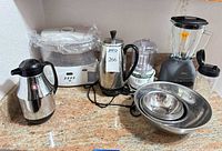 Group shot of all small appliances and bowls on countertop