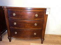 full view of dresser front showing three drawers and brass pulls