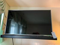 Front view of Samsung TV with sound bar beneath