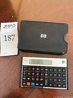 Front view of HP 12c Platinum calculator and slip case