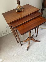 All three oak tables nested together showing size relation