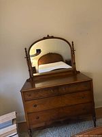 Front view of solid oak dresser with mirror