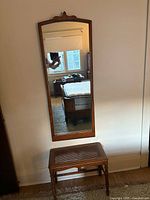 Front view of rectangular oak wall mirror mounted on wall