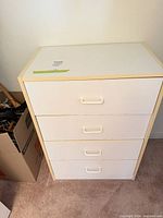 Front view of 4-drawer dresser showing full unit and handles