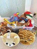 Tote with assorted plushes and two Moosh-Moosh pillow plushes in front