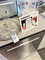 Cuisinart ICE-20C box beside glass dessert dishes on tray