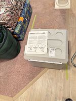 Cooler with manual on lid