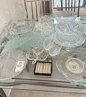Overview of all clear glass items on table