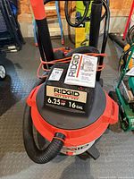 Front view of RIDGID WD1700 vacuum showing label and manual