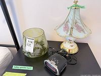 Table lamp, green etched shade, NexxTech clock radio grouped on tabletop