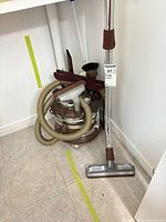 Canister vacuum with hose, wand and floor nozzle